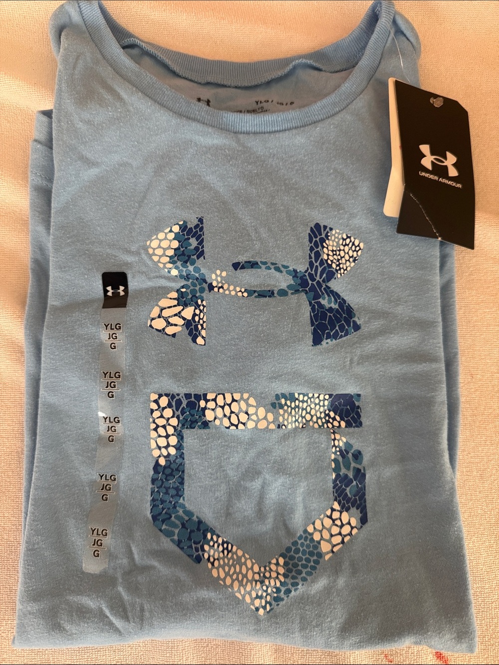 Under Armour Girls Light Blue Short Sleeve Softball Tee with Blue Patterned Logo